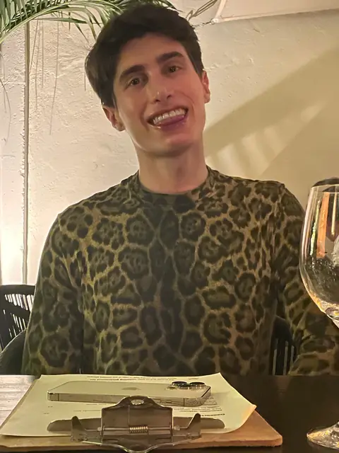 Fluffy in a leopard-print top at dinner